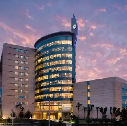 A building with many windows and lights on it