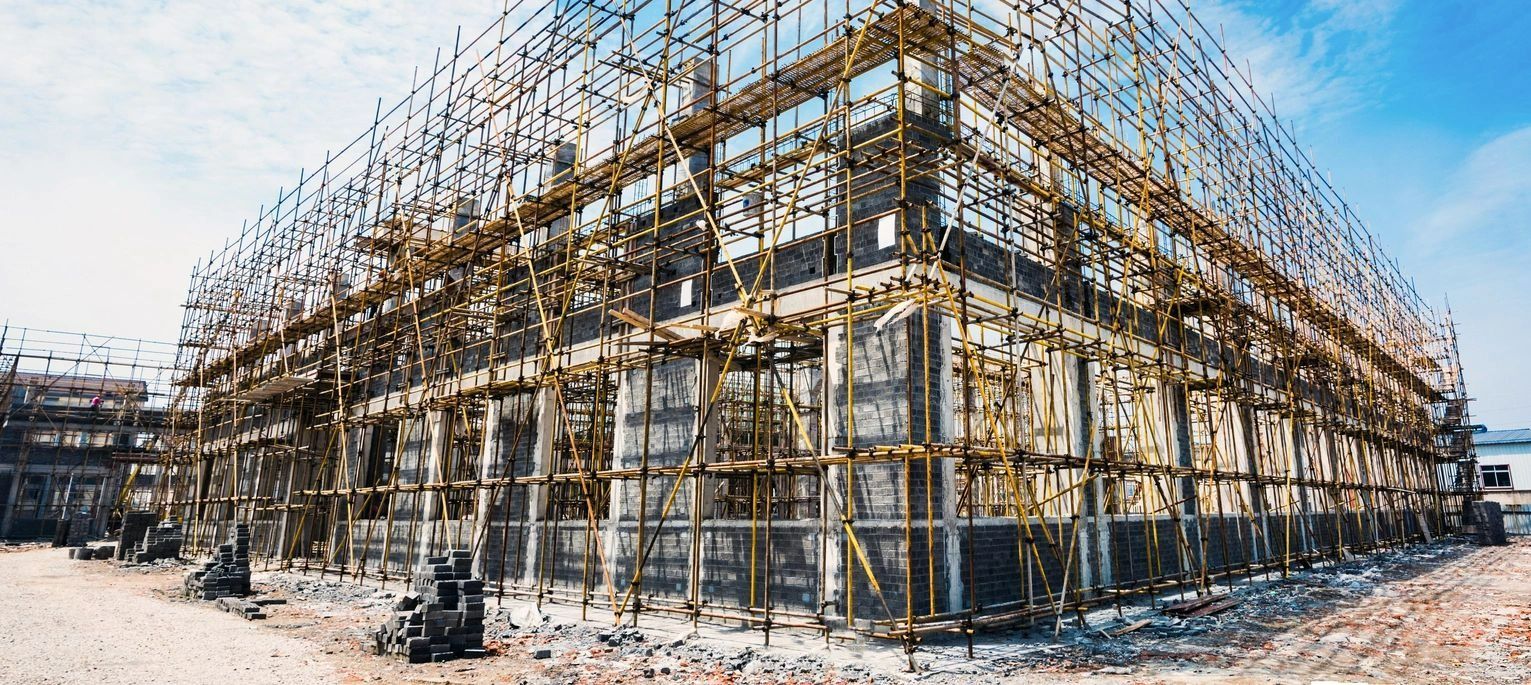 A building under construction with scaffolding around it.