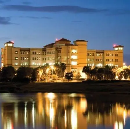 A large building with lights on the top of it