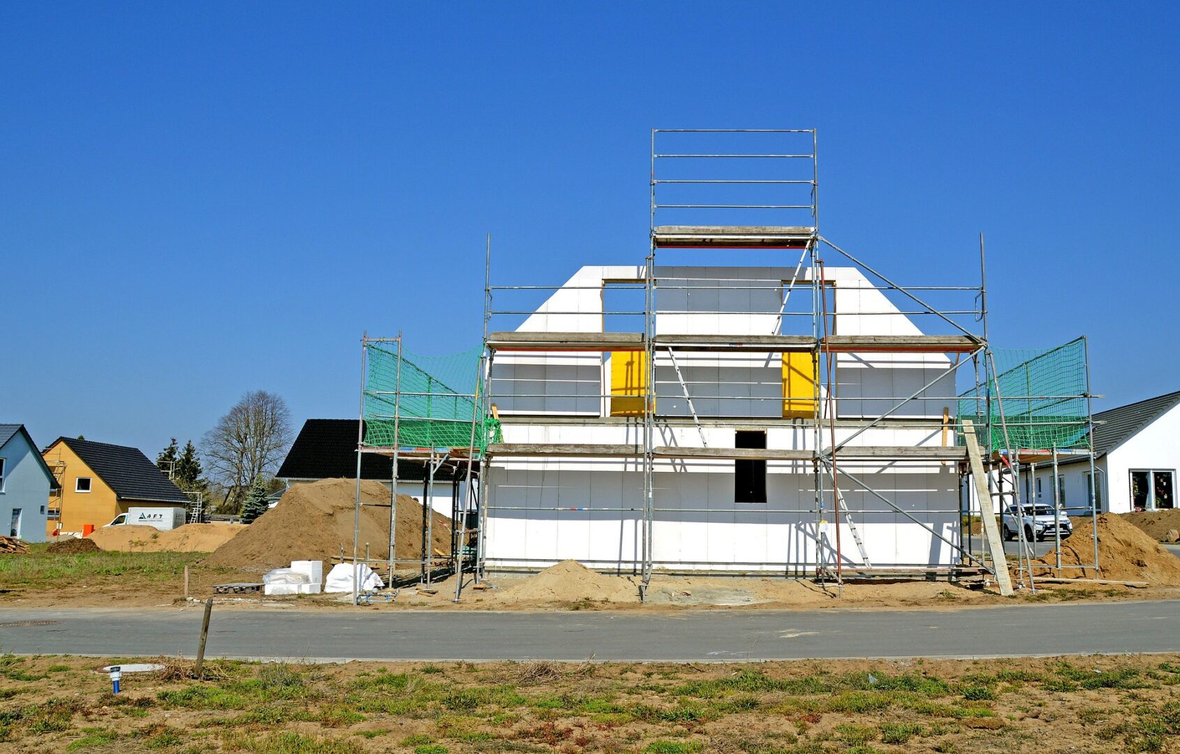 A building under construction with scaffolding around it.