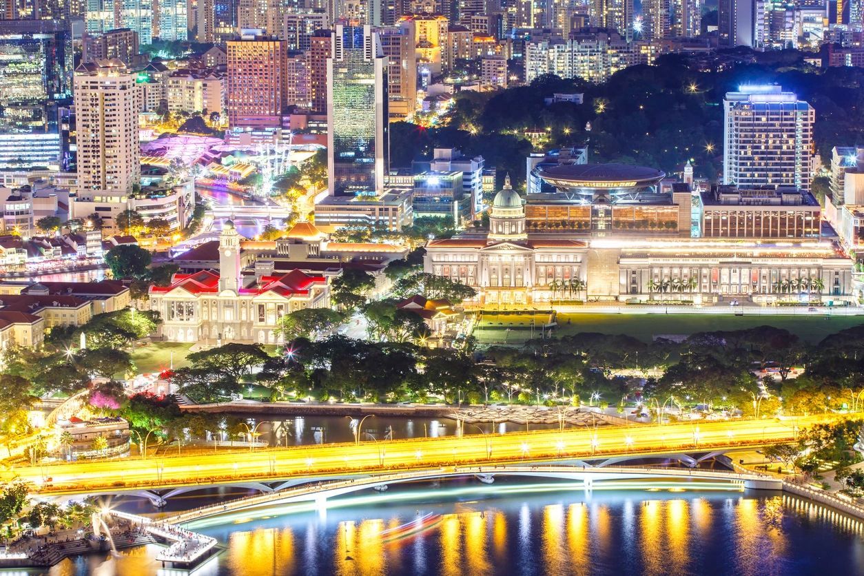 A city with lights and water at night.