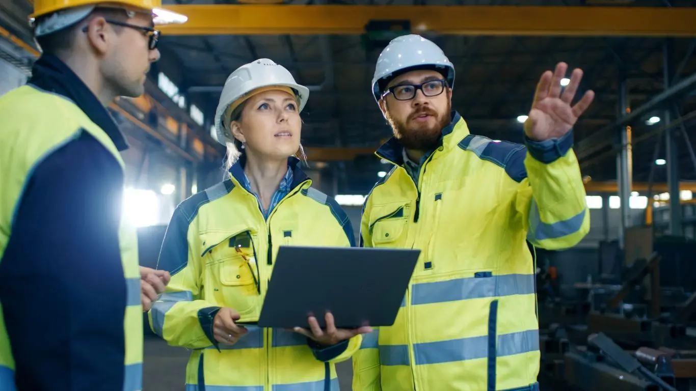 A group of people in hard hats and jackets.